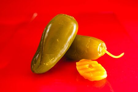 Jalapenos, jalapeÃ±o chile mexican food spicy chiles mexico city on a red backgroundの写真素材