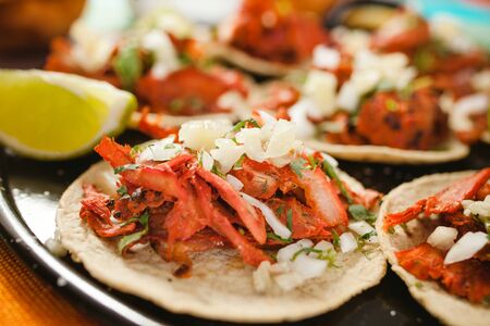 Fresh Mexican tacos al pastor with lemon and sauce in Mexicoの写真素材