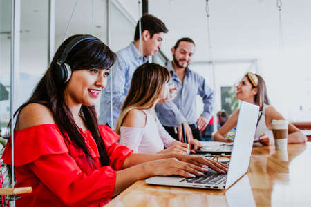 Latin woman student with group of students at university in Mexico, Mexican peopleの写真素材