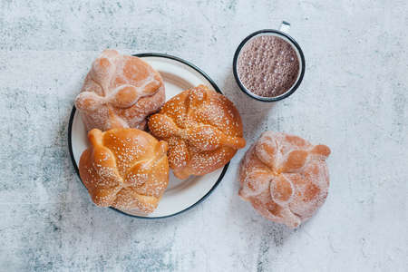 Pan de Muerto and hot chocolate, Mexican bread traditional for day of the Dead in Mexicoの写真素材