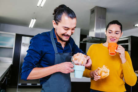 Mexican people eating Pan de Muerto traditional bread for day of the dead in Mexicoの写真素材