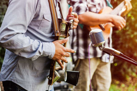 latin musicians playing percussion instrument and guitar at the street in Mexicoの写真素材
