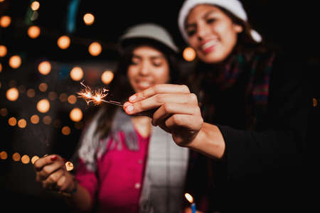 Mexican Posada, group of friends with sparklers in Christmas in Mexicoの写真素材