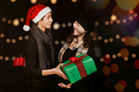 mexican friends exchanging gifts on Christmas party in Mexico