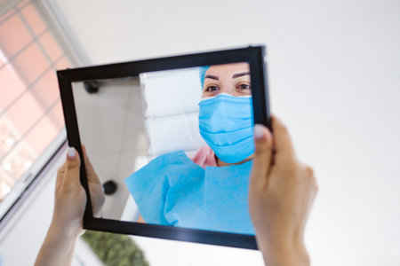 Latin woman Beautician Doing Eyebrow Tattooing For Female, FacePermanent, Makeup For Eyebrows, Microblading brow in Mexico cityの写真素材