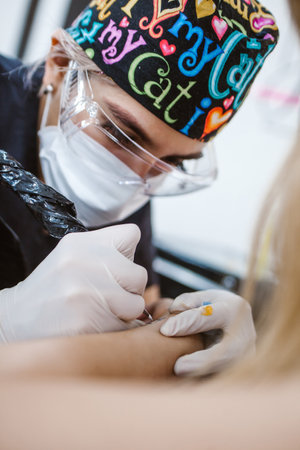latin woman tattoo master showing a process of creation tattoo in Mexico city