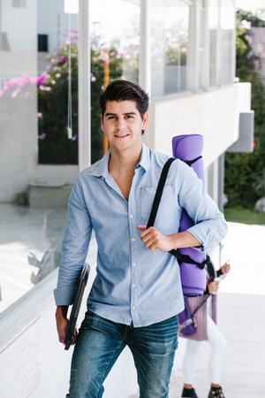 young latin man or student practicing breathing yoga exercises at university in Mexico city