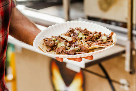 cooking Mexican tacos with beef, traditional street food in Mexico cityの写真素材