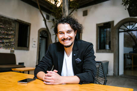 Portrait of latin business man looking at camera in a creative office in Mexico cityの写真素材