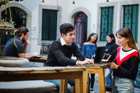 Young Latin university students spending free time at college in Latin America