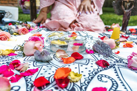 Latin woman with amethyst stones and healing crystals in water for holistic therapy in Latin Americaの写真素材