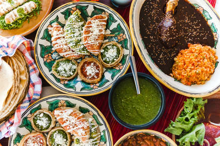 Traditional mexican dishes sopes, tacos dorados, tortillas, mole poblano, red rice, rajas poblanas,...