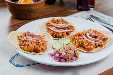 Mexican tacos with cochinita pibil, onion and lemon, traditional Mexican food in Mexico Cityの写真素材