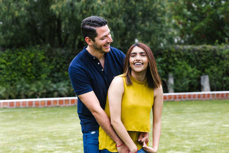 Young hispanic couple in love having fun and enjoying the beautiful nature in latin americaの写真素材