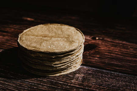 mexican tortilla corn cob maize on wooden table in Mexicoの写真素材