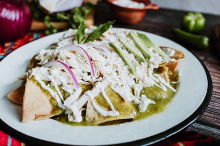 mexican chilaquiles with chicken and spicy green sauce traditional breakfast in Mexicoの写真素材