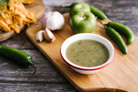 Mexican green sauce with chili peppers, green tomatoes and garlic in typical food of Mexico Cityの写真素材