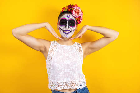 Mexican Catrina, portrait of young latin woman for Halloween party in Mexico
