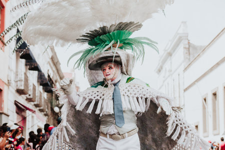 Huehues Mexico, Mexican Carnival dancer wearing a traditional folk costume and mask in Latin Americaの写真素材