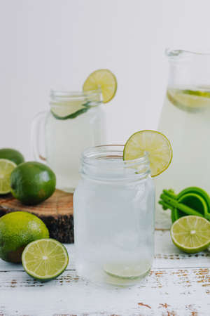 Refreshing lemonade with lime and mint in a glass jar.の写真素材
