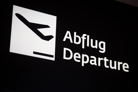 Airport Flight Information: Departures Sign on black backgroundの写真素材