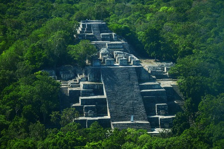 Campeche, Mexico: Ruins of the ancient Mayan city of Calakmul surrounded by the jungleの写真素材