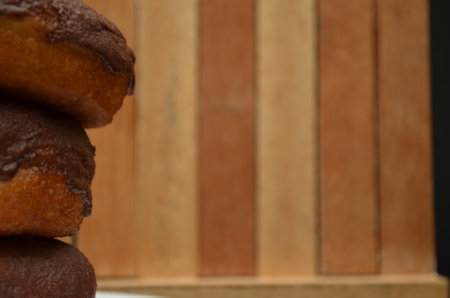 Beautiful handmade donuts covered in chocolate and sugarの写真素材