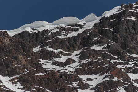 Natural Monument El Morado, Central Andes of Chile. Beautiful landscape of snowy rocky mountain.