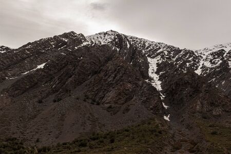 Mountain landscape during winter in Lo ValdÃ©s Valley, CajÃ³n del Maipo, Central Andes of Chile.の写真素材