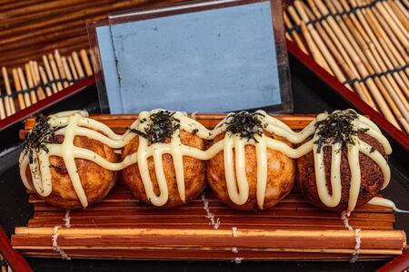 A set of delicious takoyaki at a market in Bangkok, Thailandの写真素材