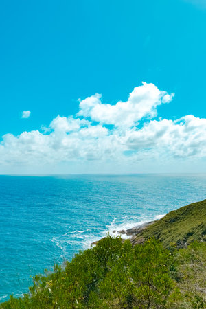 Beautiful seascape with turquoise sea and green hillの写真素材