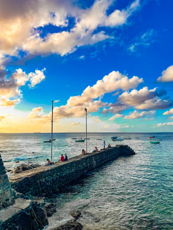 Unidentified people on the pier at sunset.の写真素材