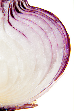 Red onion closeup isolated in white backgroundの写真素材