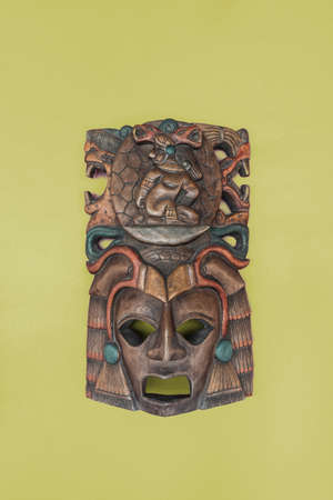 Indigenous mask in yellow background