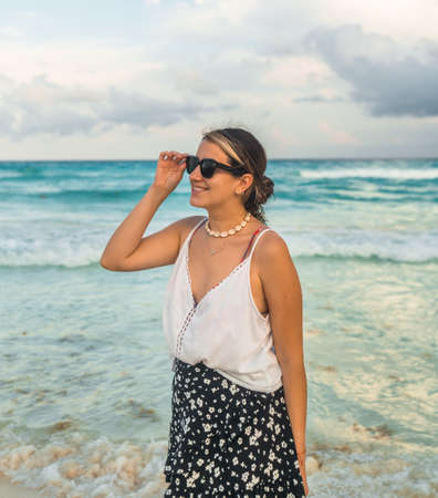 young hispanic woman with sunglasses in cancun - travel conceptの写真素材
