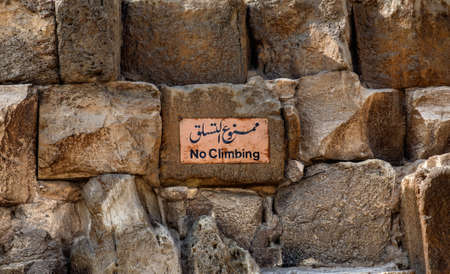 Sign on the wall of the ancient city of Caesarea, Israelの写真素材