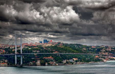 Bosphorus Bridge in Istanbul, Turkey. Dramatic stormy sky.の写真素材