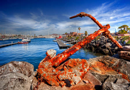 Old rusty anchor in the portの写真素材