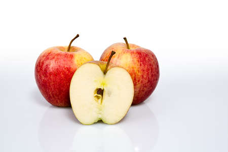 two delicious apples and an apple cut in half photography made in a photography studio