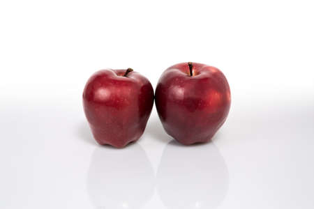 two red apples photograph taken in photography studio