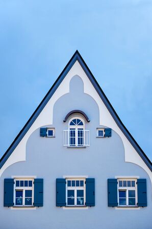 Plain blue house in Bavaria with blue skyの写真素材