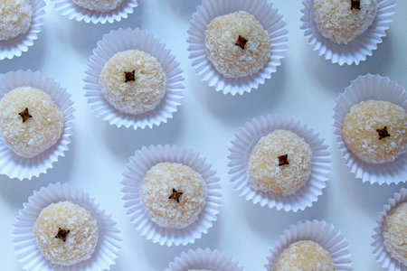 Sweet made from coconut, called "Beijinho", typical at a birthday party in Brazilの写真素材