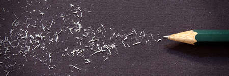 Graphite pencil on black background with rubber tracksの写真素材