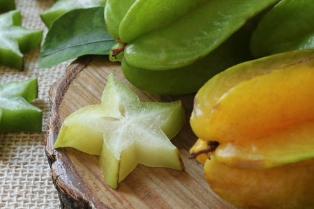 Tasty carambola fruit on wooden table.の写真素材