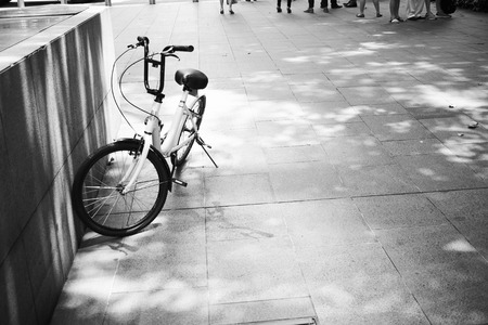 Bicycle being left at the side of the walkwayの写真素材