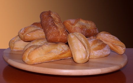 fresh bread on wooden breadboardの写真素材