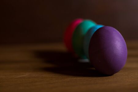 colorful easter eggs on wooden backgroundの写真素材