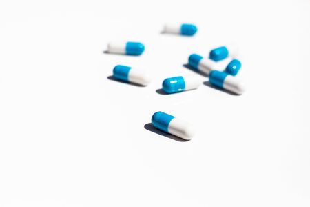 blue pills isolated on white backgroundの写真素材