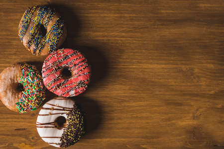 colorful donuts on a wooden table