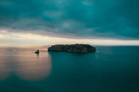 sunset over the sea in costa bravaの写真素材